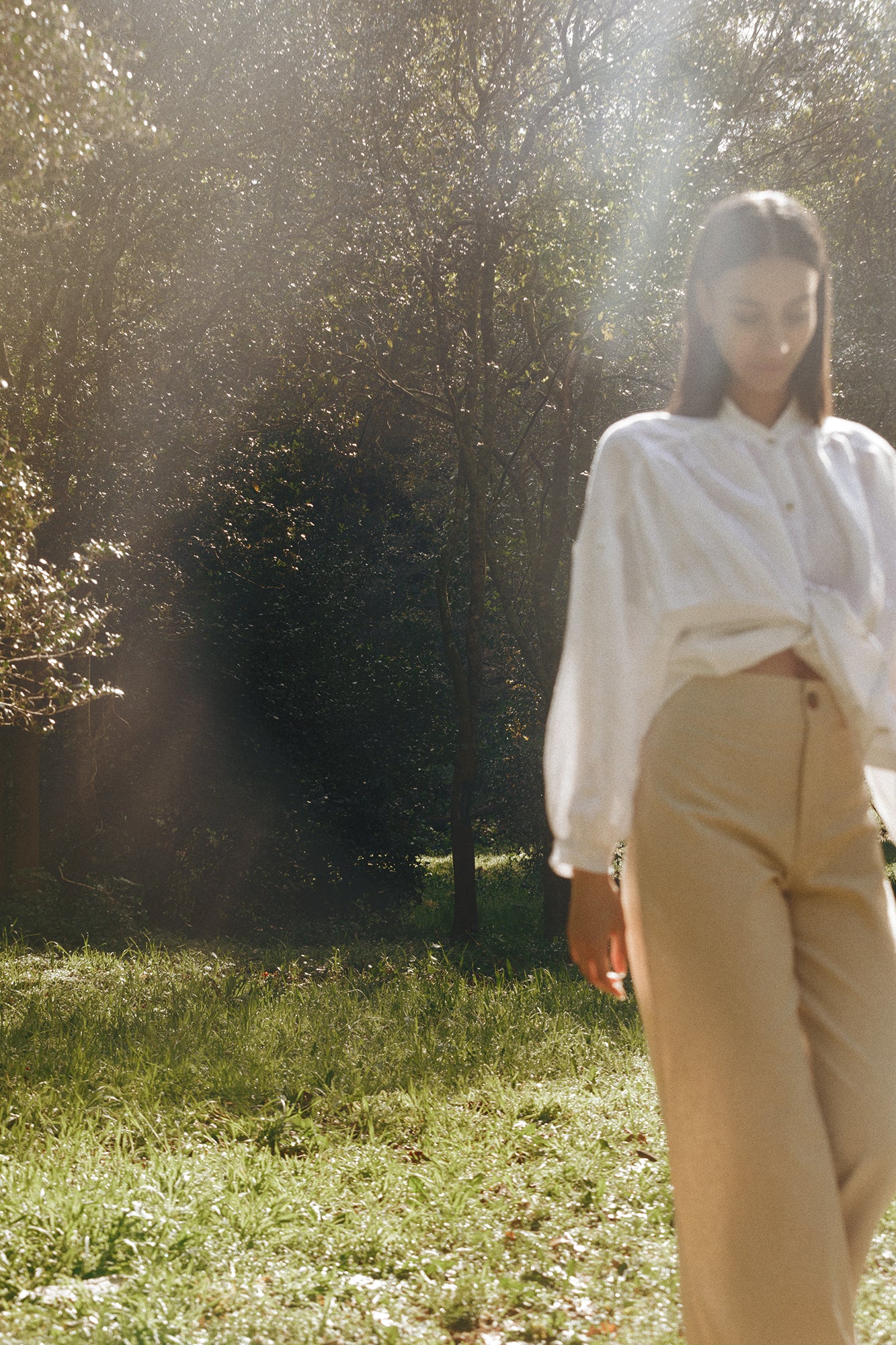 Model wearing Museā Barley Trousers in the forest
