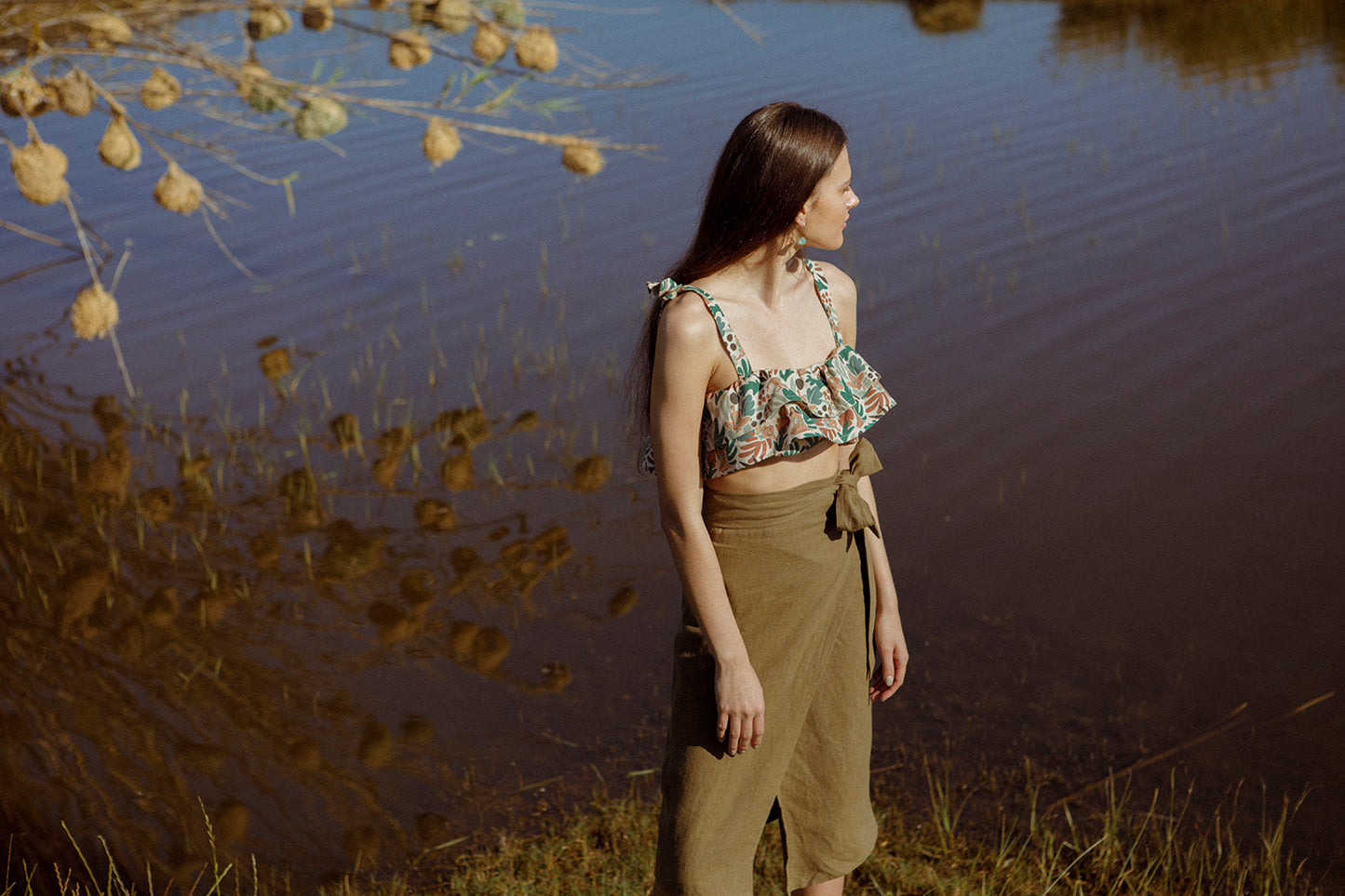Model wearing the wrap skirt and Ella bandeau top