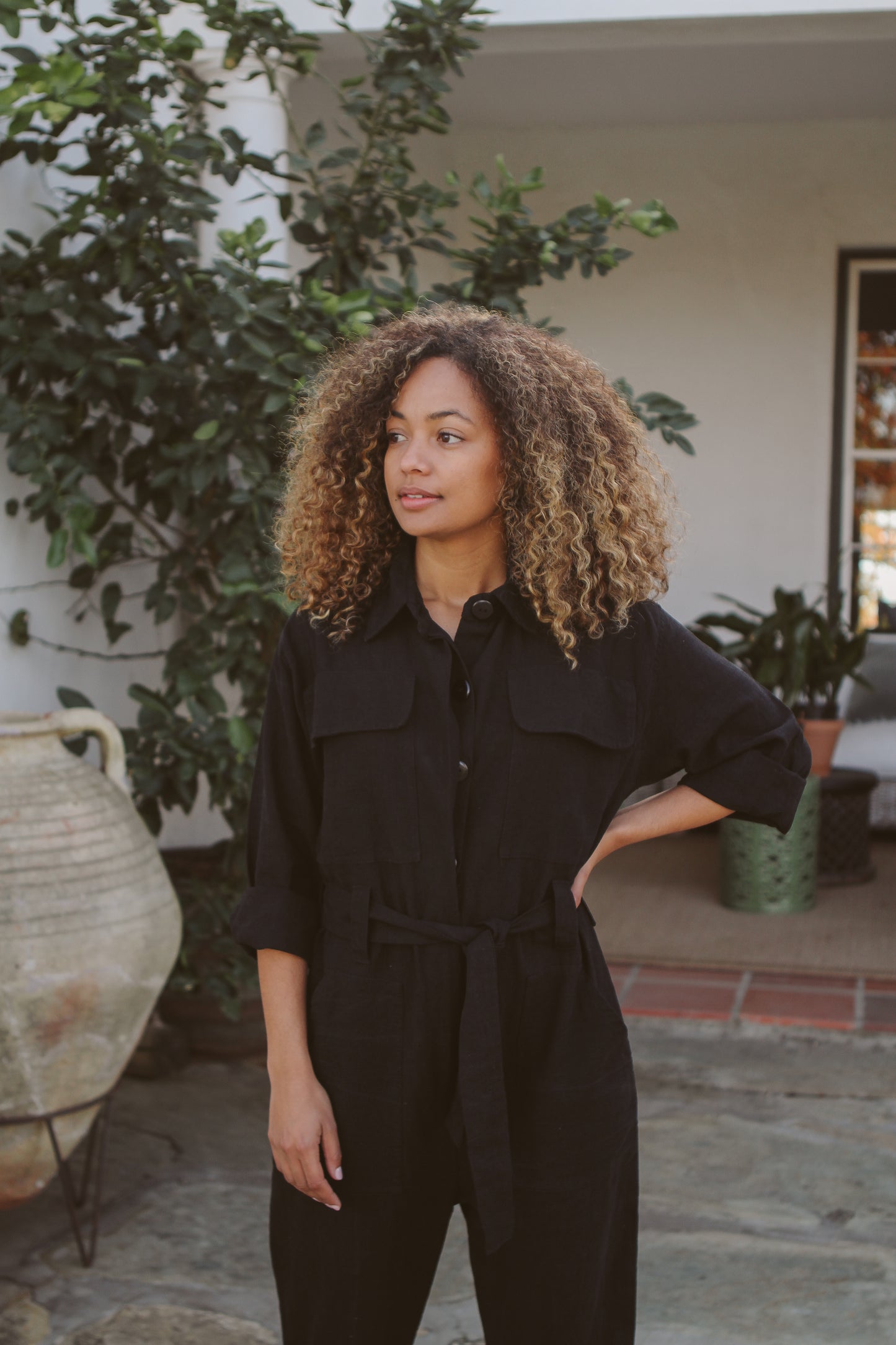 Model wearing black jumpsuit