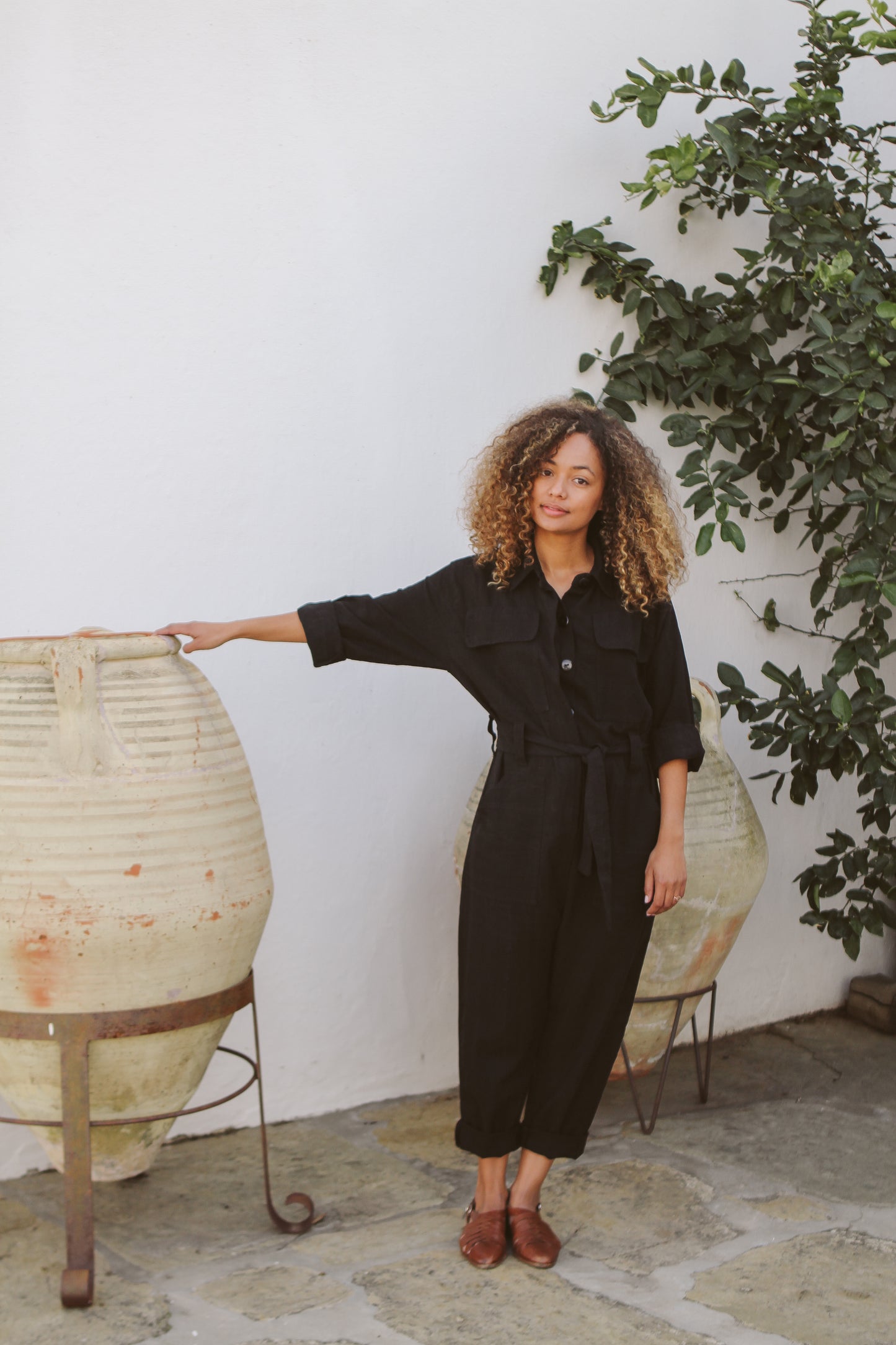 Model wearing black jumpsuit