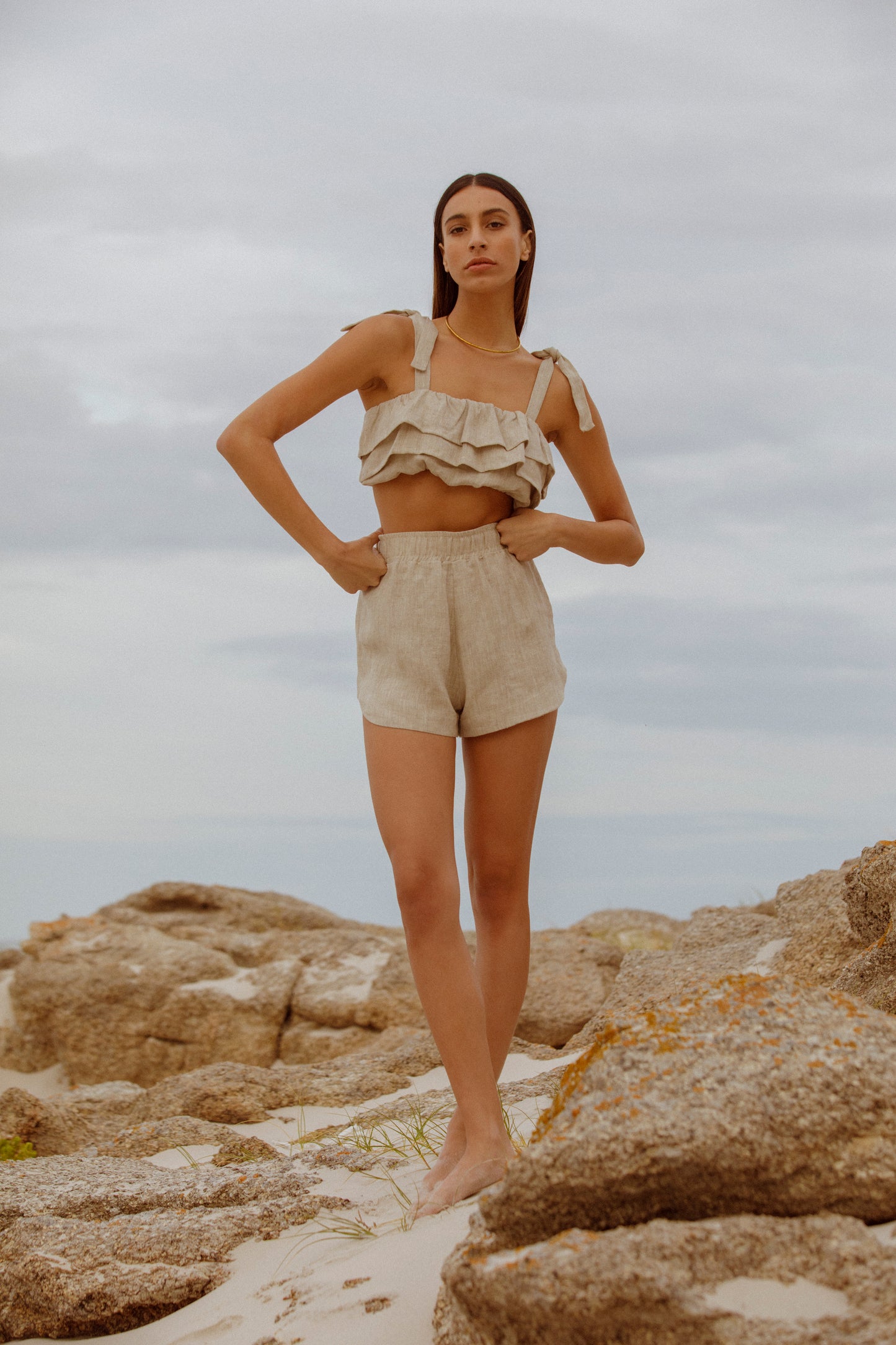 Model wearing top and shorts