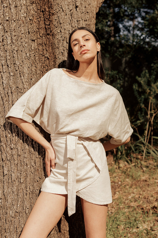 Model wearing Cherie Wrap Skirt in oatmeal linen cotton blend