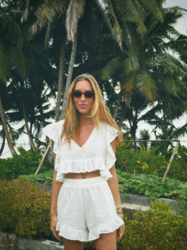 Model wearing frilly set