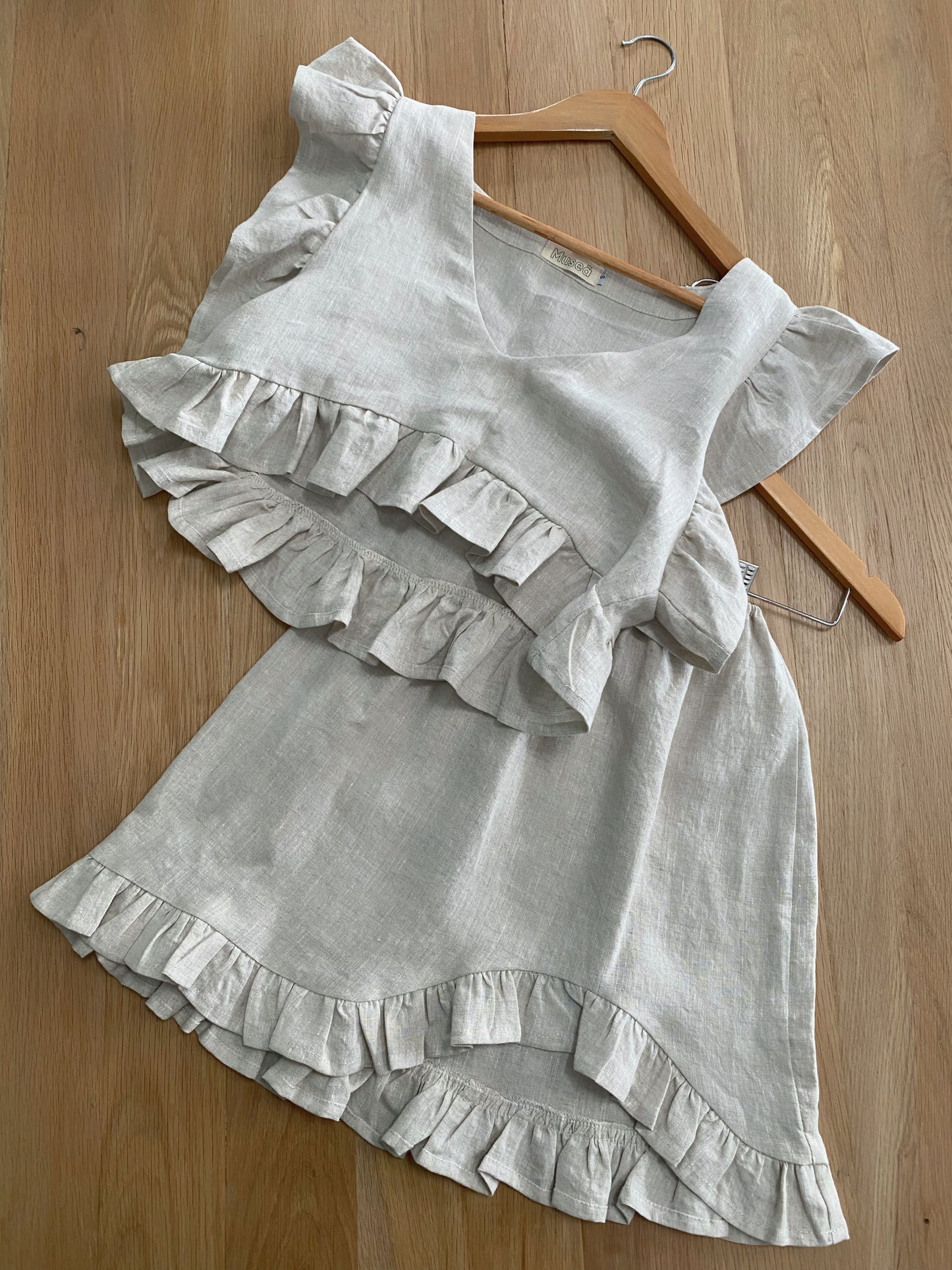 Flat lay of the frilly linen top and frilly linen skirt