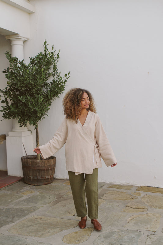 Model walking while wearing her jacket