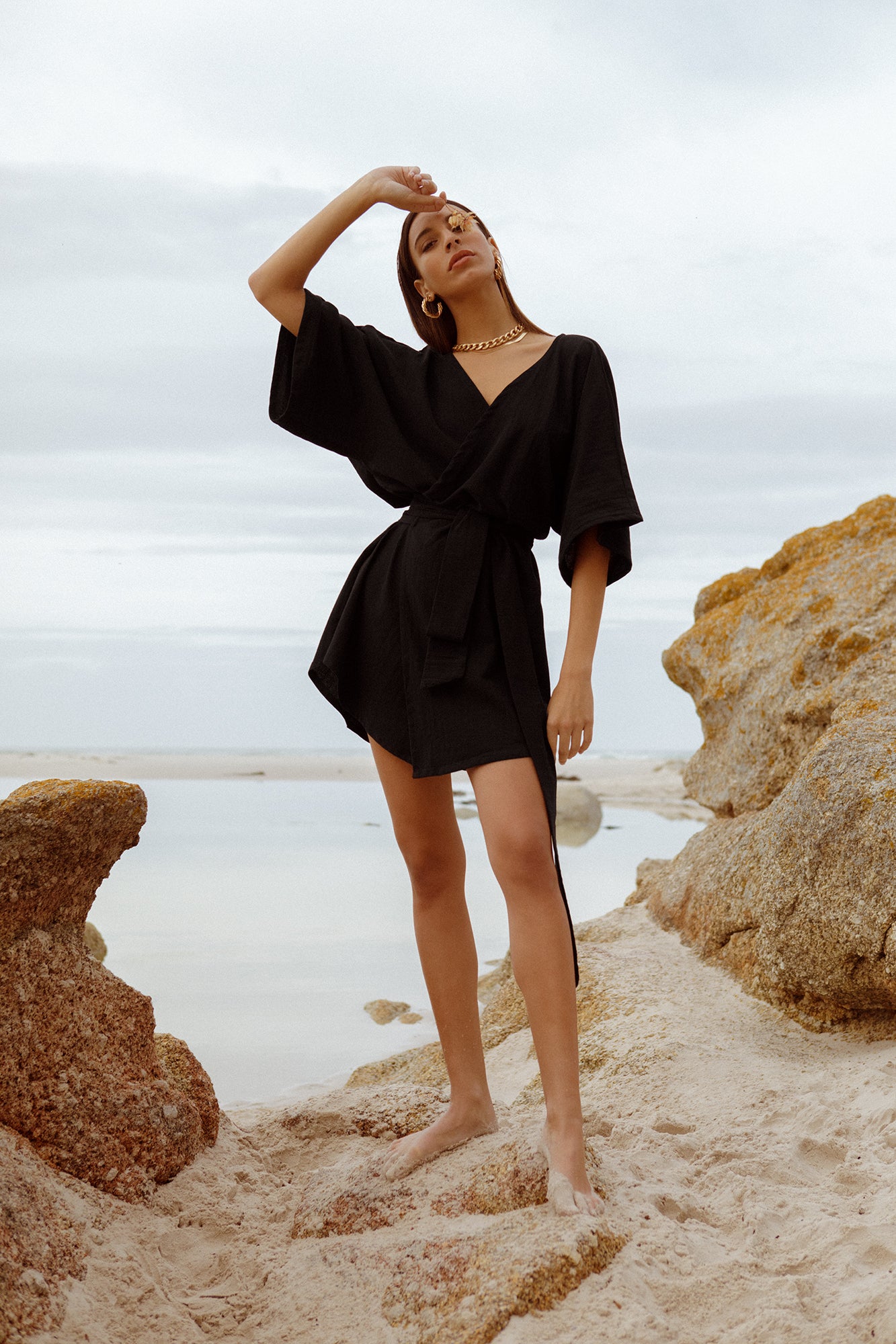model wearing short Alya dress in black cotton